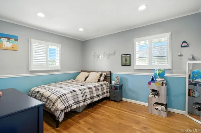 a bedroom that has a bed and a table in it