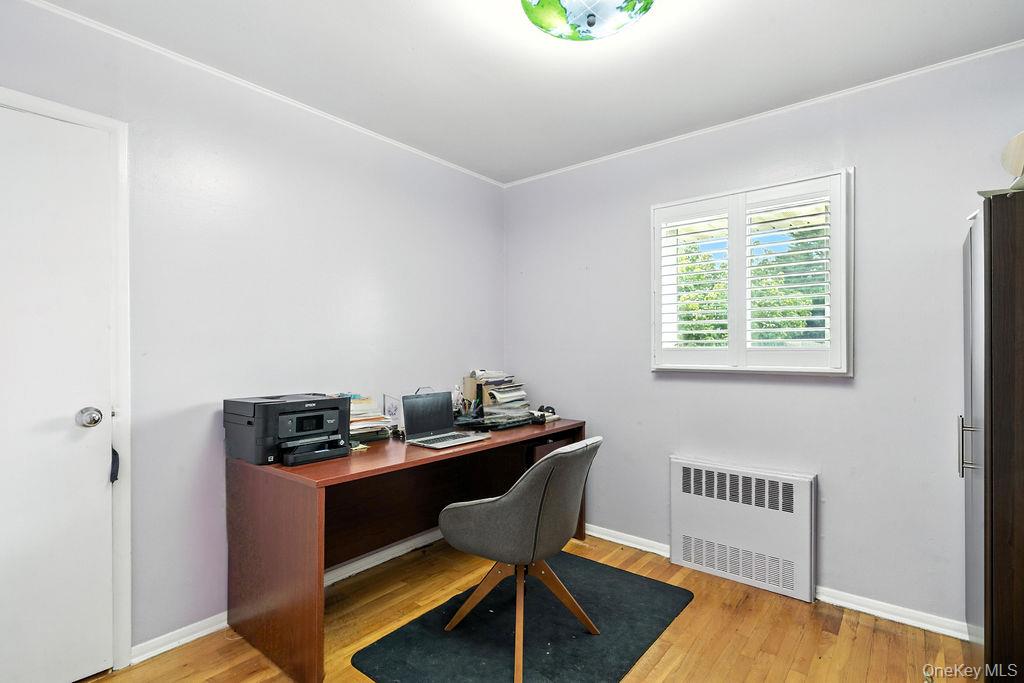 21 Macarthur Avenue Plainview, NY 11803 - Photo 16 of 26 a view of a workspace with furniture and a window