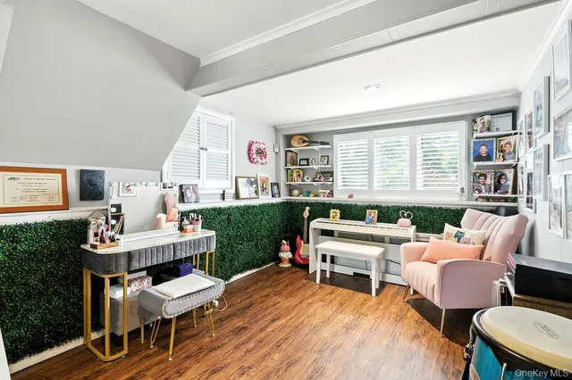 a living room with furniture a large window and a table