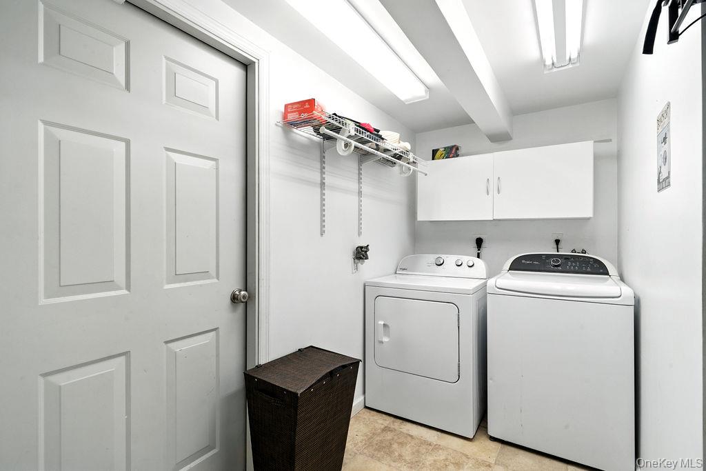 21 Macarthur Avenue Plainview, NY 11803 - Photo 19 of 26 a view of storage and utility room with washer and dryer