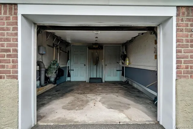 a view of a hallway with wooden shelves