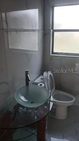 a bathroom with a toilet and a sink