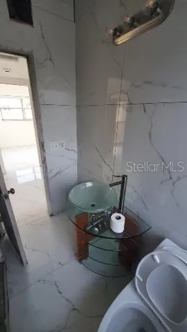 a bathroom with a toilet and a sink