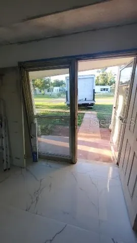 a view of a livingroom with furniture and window