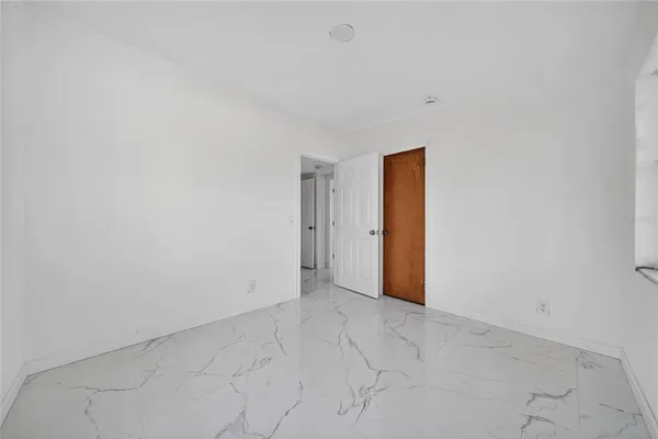a view of empty room with windows