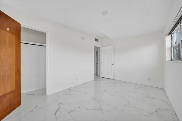 a house with trees in the background