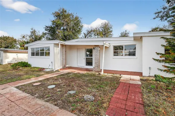 a front view of a house with yard