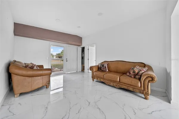 a living room with furniture and a couch