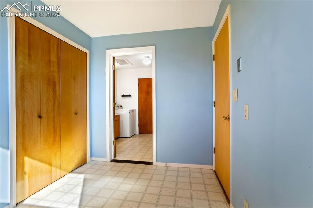 375 North Rush Road Rush, CO 80833 - Photo 20 of 32 a view of a hallway with wooden floor and a bathroom