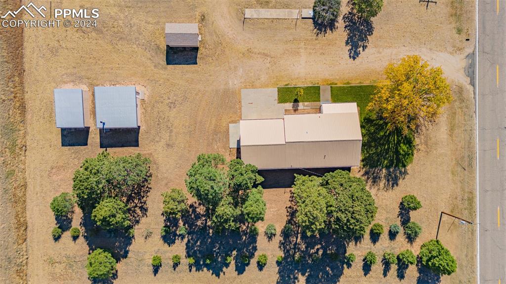 375 North Rush Road Rush, CO 80833 - Photo 28 of 32 an aerial view of a house with a yard and garden