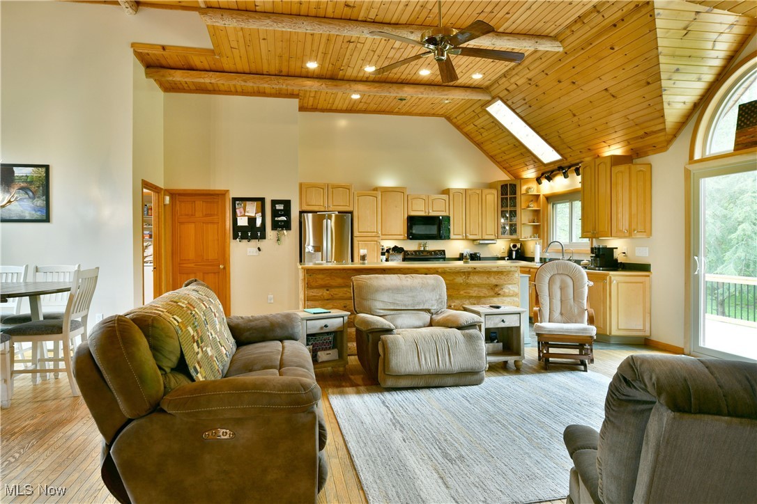 2907 Bushnell Campbell Road Fowler, OH 44418 - Photo 8 of 49 Living area featuring wood ceiling, high vaulted ceiling, light wood-style floors, a ceiling fan, and recessed lighting