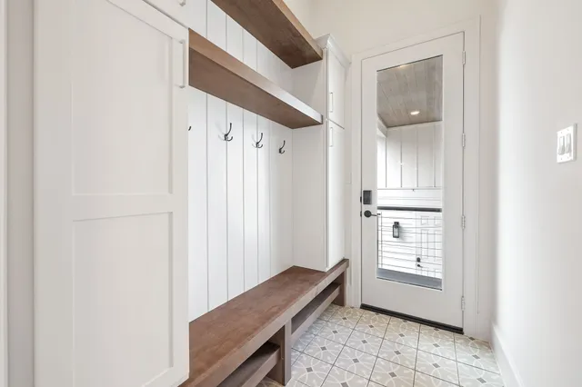 a view of room with window and hallway