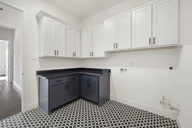 a kitchen with a sink and cabinets