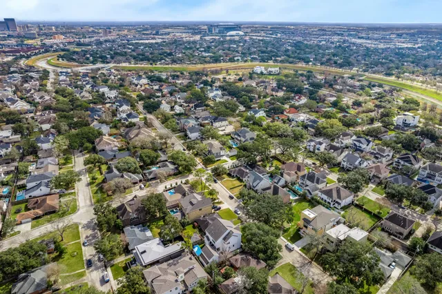 an aerial view of residential houses with outdoor space