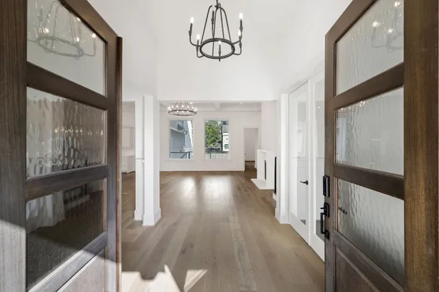 a view of an entryway with wooden floor