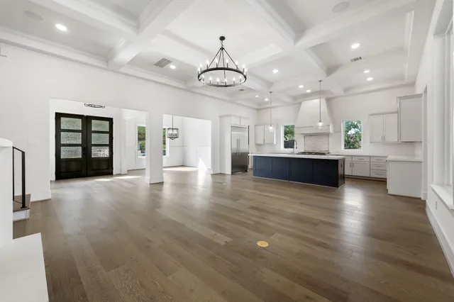 a view of a kitchen with a sink and a stove top oven