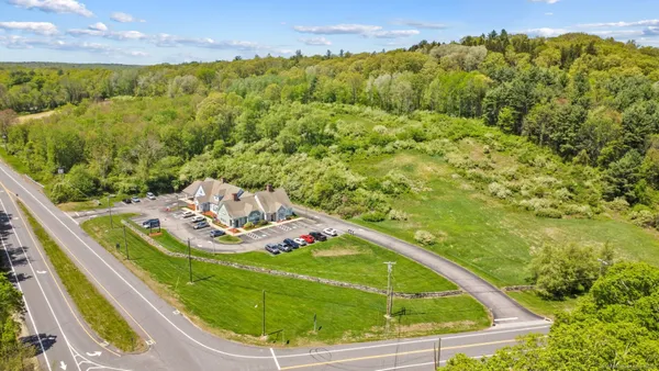 a view of a swimming pool with a yard