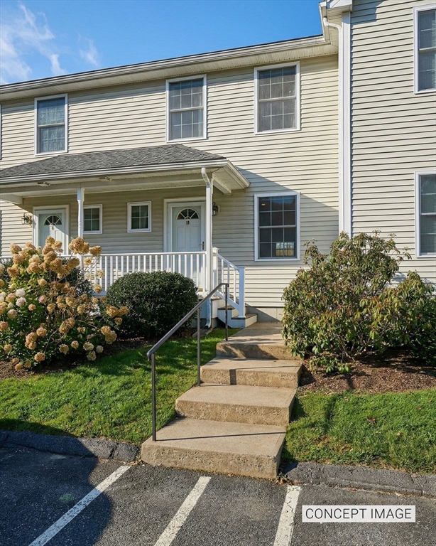 8 Hockanum Road, Unit 10 Northampton, MA 01060 - Photo 1 of 34 a front view of a house with a yard