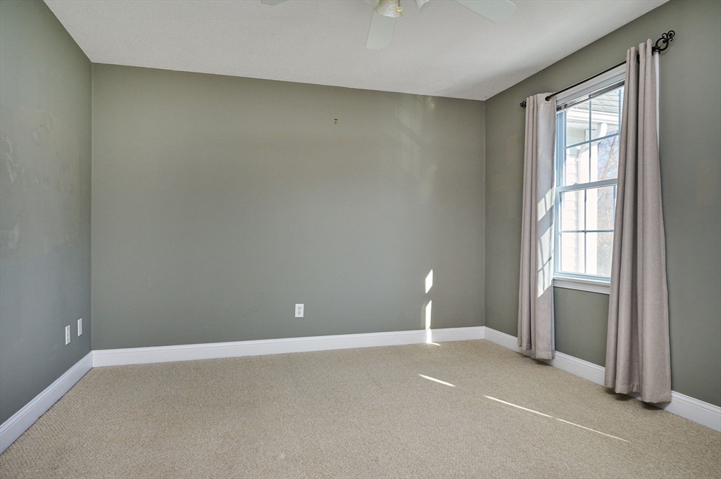 8 Hockanum Road, Unit 10 Northampton, MA 01060 - Photo 13 of 34 an empty room with windows and closet