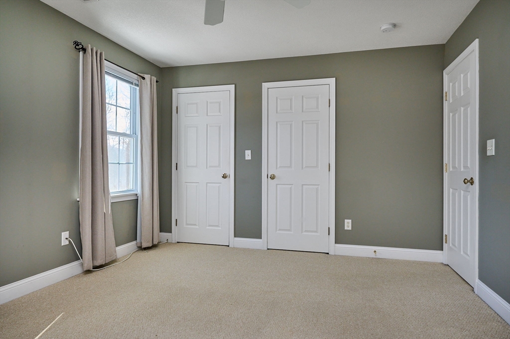 8 Hockanum Road, Unit 10 Northampton, MA 01060 - Photo 14 of 34 an empty room with windows and closet