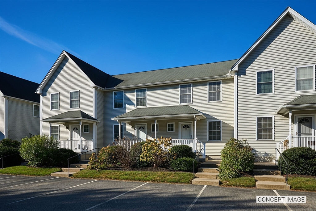 8 Hockanum Road, Unit 10 Northampton, MA 01060 - Photo 2 of 34 a front view of a house with a yard