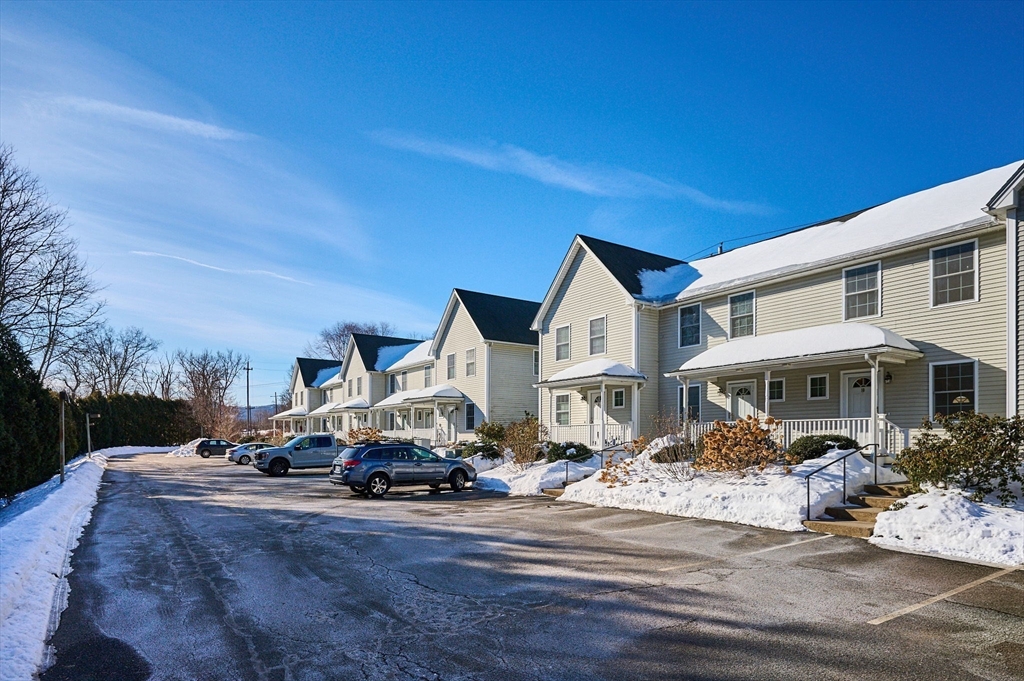 8 Hockanum Road, Unit 10 Northampton, MA 01060 - Photo 24 of 34 a car parked in front of white house