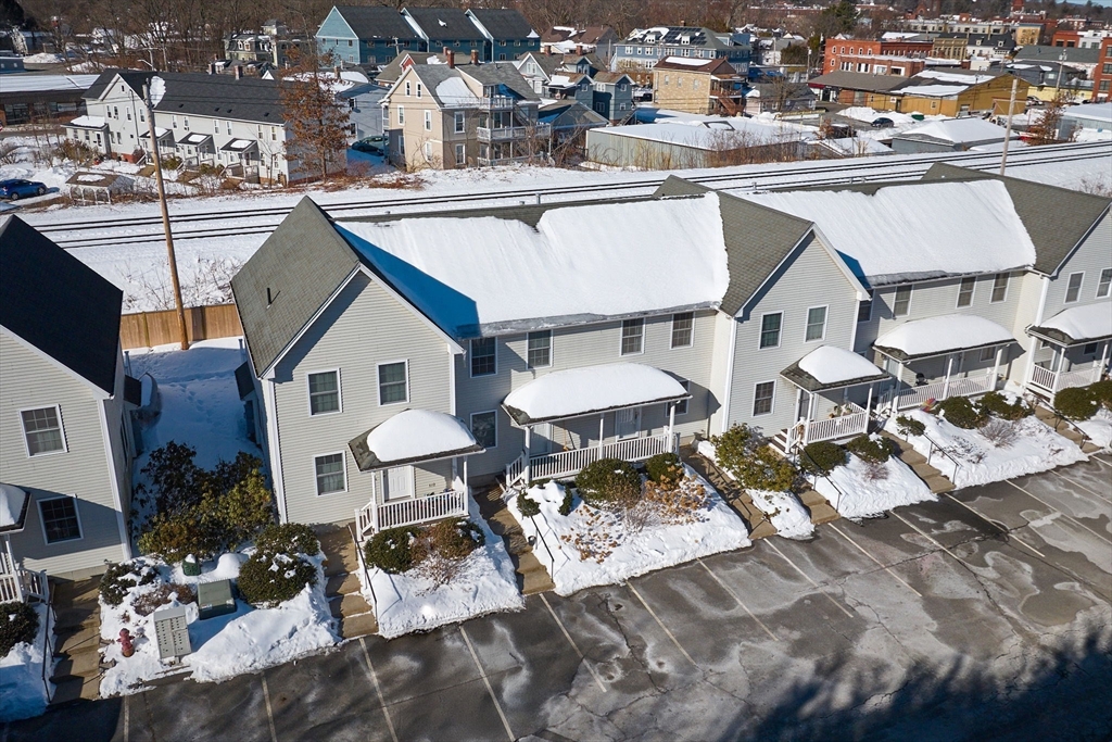 8 Hockanum Road, Unit 10 Northampton, MA 01060 - Photo 26 of 34 a view of a white house with a sink yard and outdoor seating