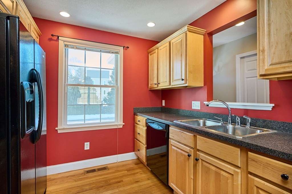 8 Hockanum Road, Unit 10 Northampton, MA 01060 - Photo 4 of 34 a kitchen with granite countertop a sink a stove and cabinets