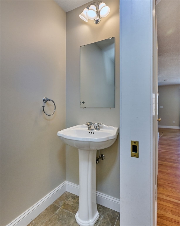 8 Hockanum Road, Unit 10 Northampton, MA 01060 - Photo 9 of 34 a bathroom with a sink a mirror and vanity