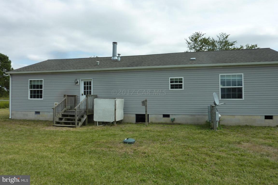 6380 Powellville Road Willards, MD 21874 - Photo 2 of 10 a view of a backyard with a sitting area