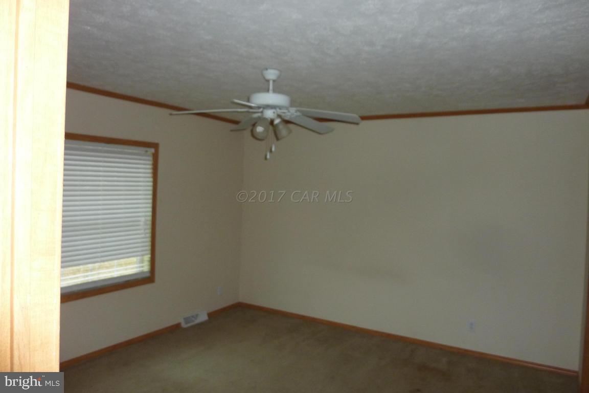6380 Powellville Road Willards, MD 21874 - Photo 4 of 10 an empty room with a window