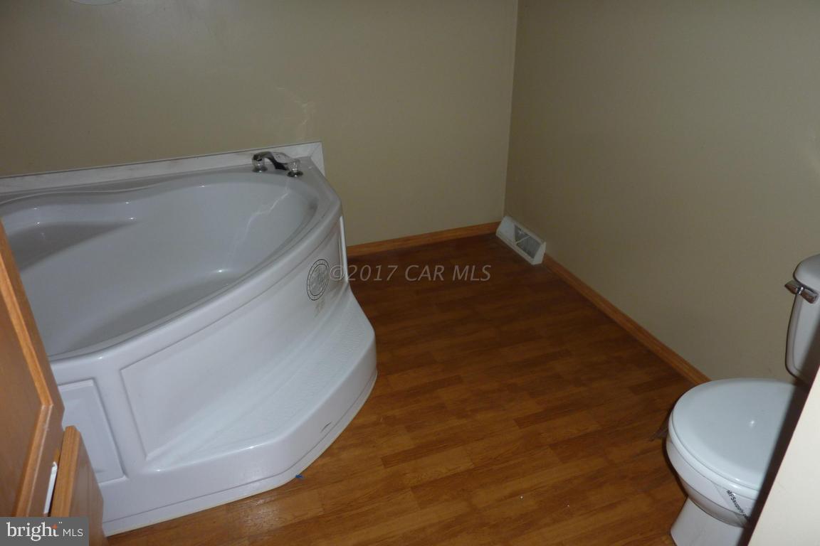6380 Powellville Road Willards, MD 21874 - Photo 5 of 10 a bathroom with a toilet and a sink