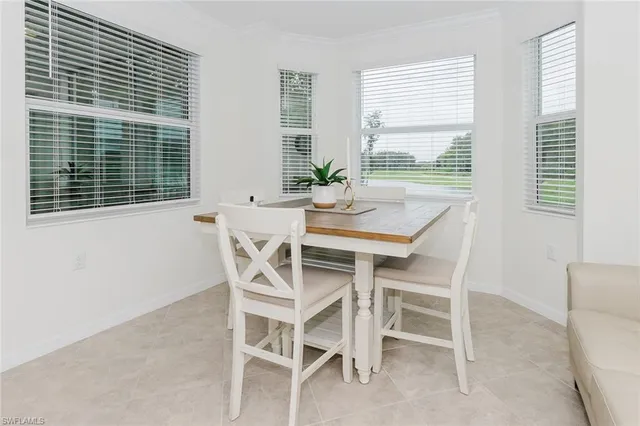 a bedroom with a bed and a washing machine in it
