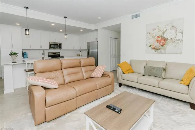 a living room with furniture and a couch
