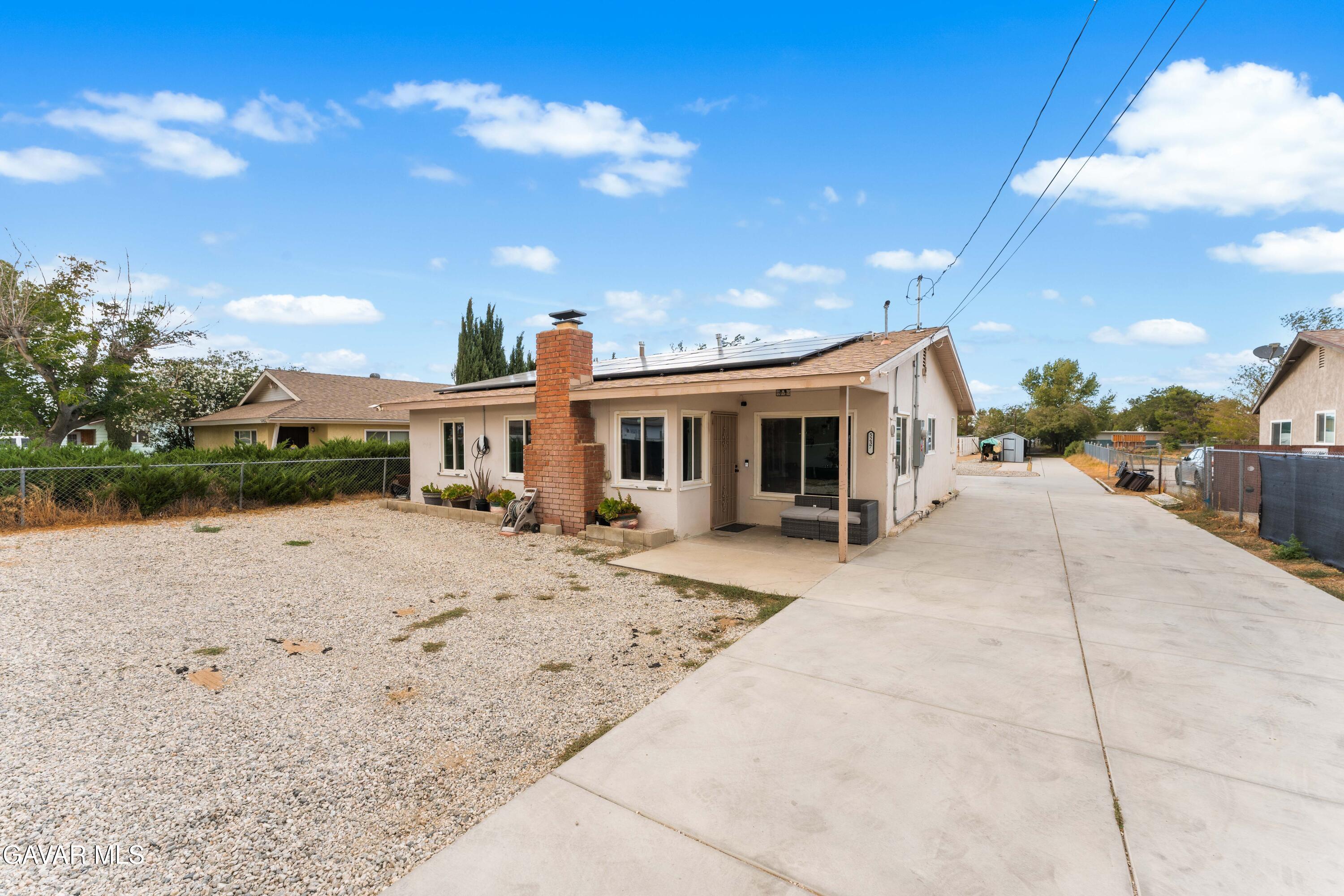 5237 West Ave L8 Lancaster, CA 93536 - Photo 1 of 38 a view of a house with backyard and sitting area