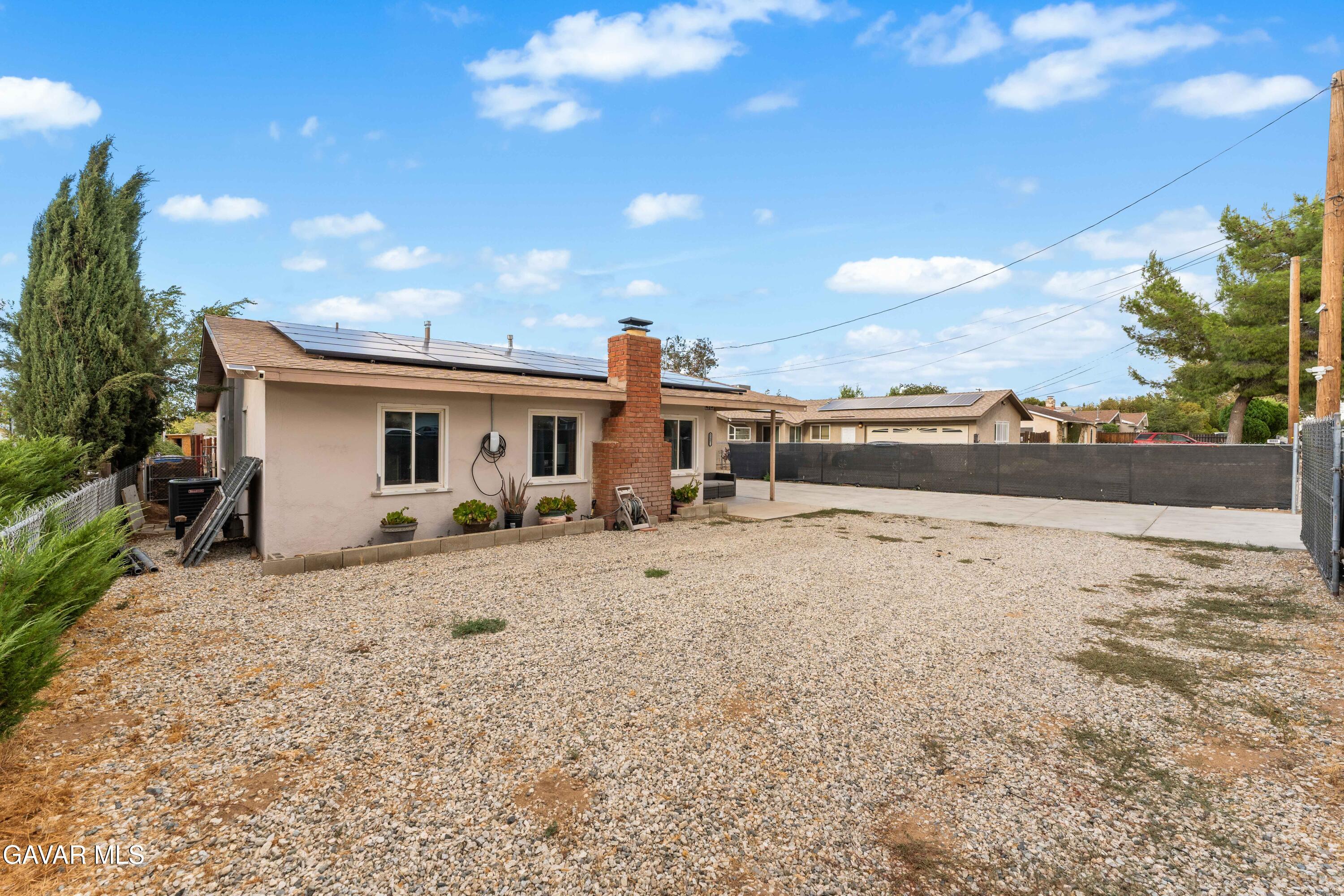 5237 West Ave L8 Lancaster, CA 93536 - Photo 35 of 38 a view of a dry yard with wooden fence
