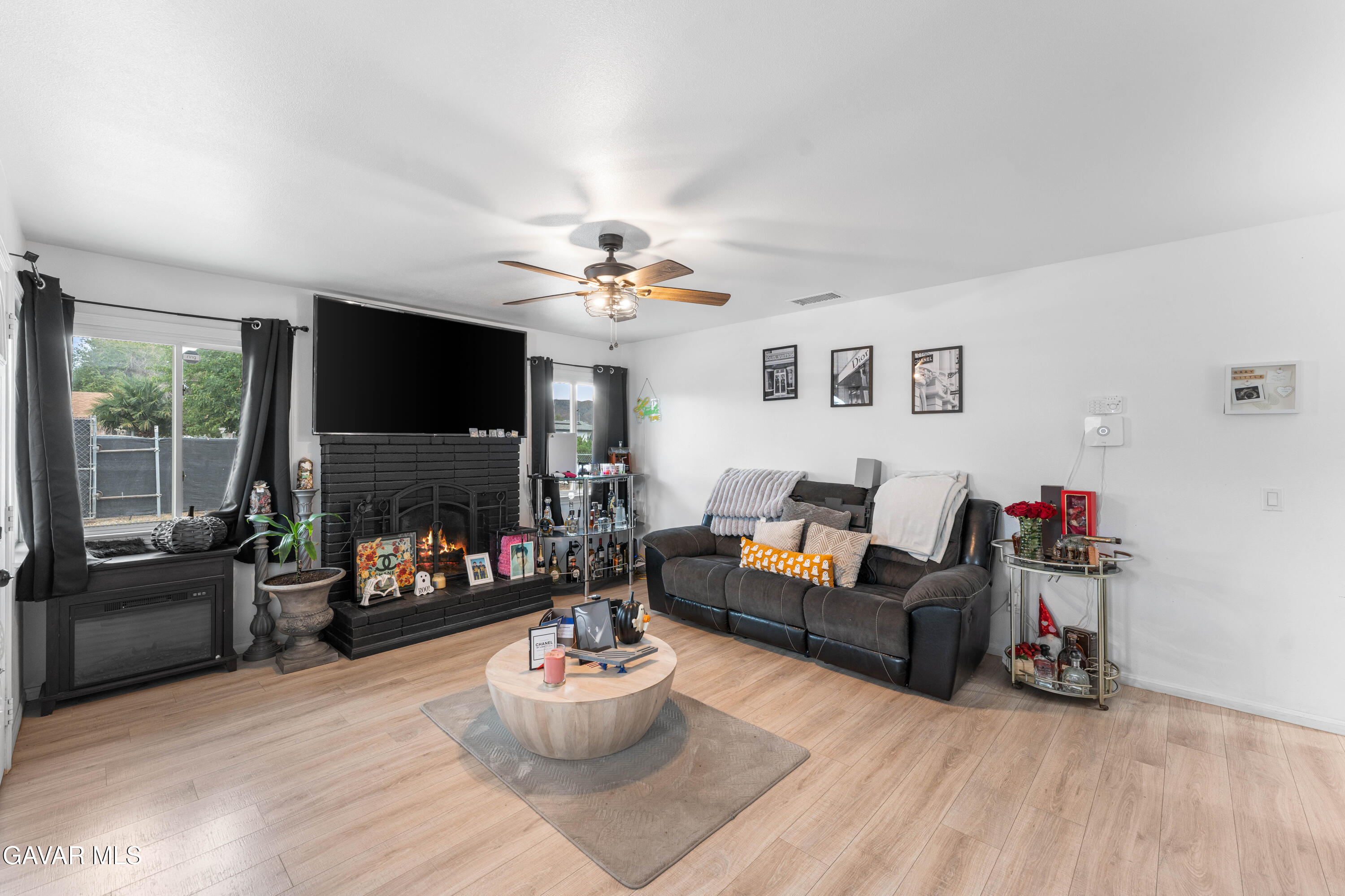 5237 West Ave L8 Lancaster, CA 93536 - Photo 6 of 38 a living room with furniture and a flat screen tv