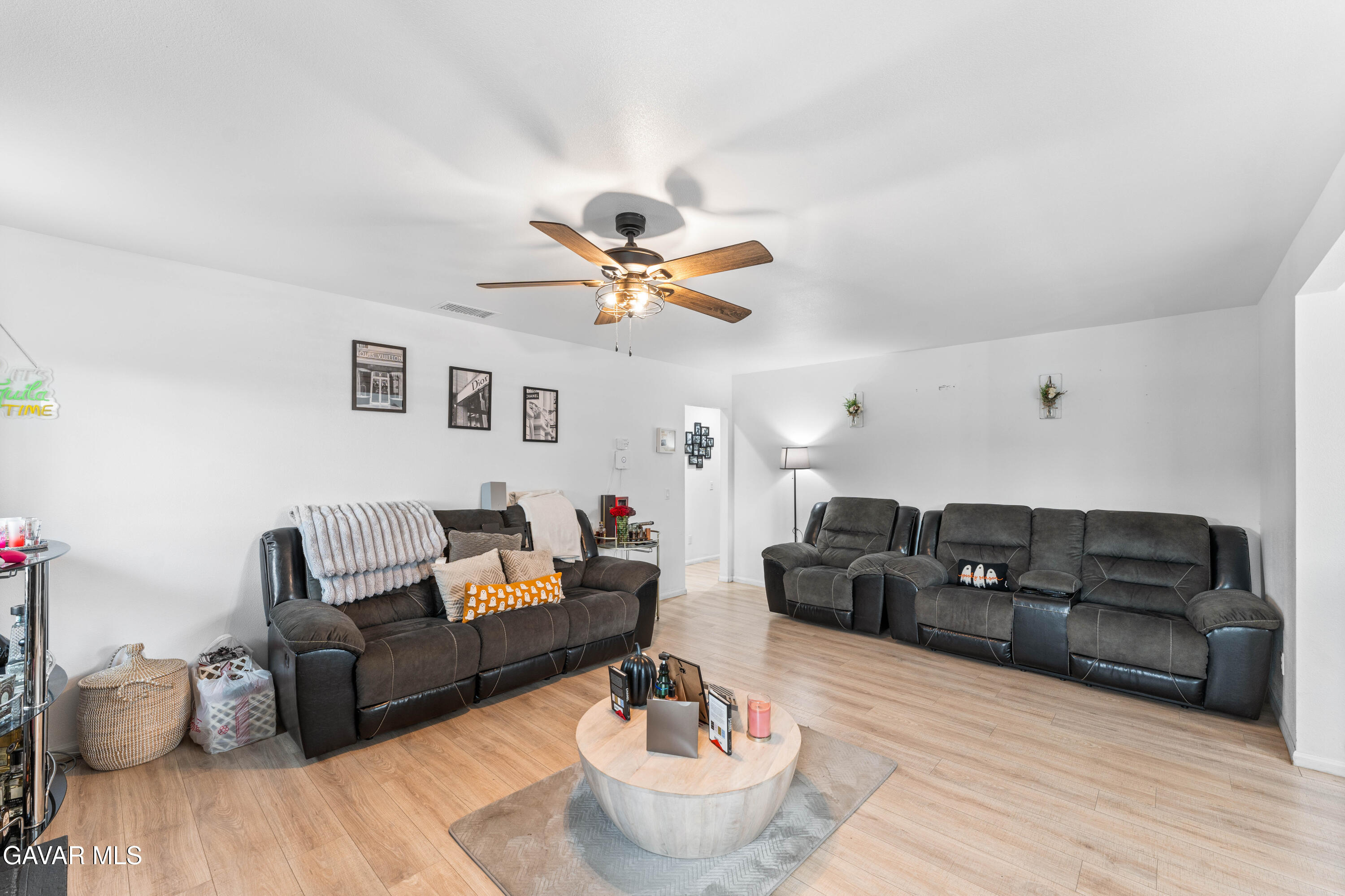 5237 West Ave L8 Lancaster, CA 93536 - Photo 7 of 38 a living room with furniture and a chandelier