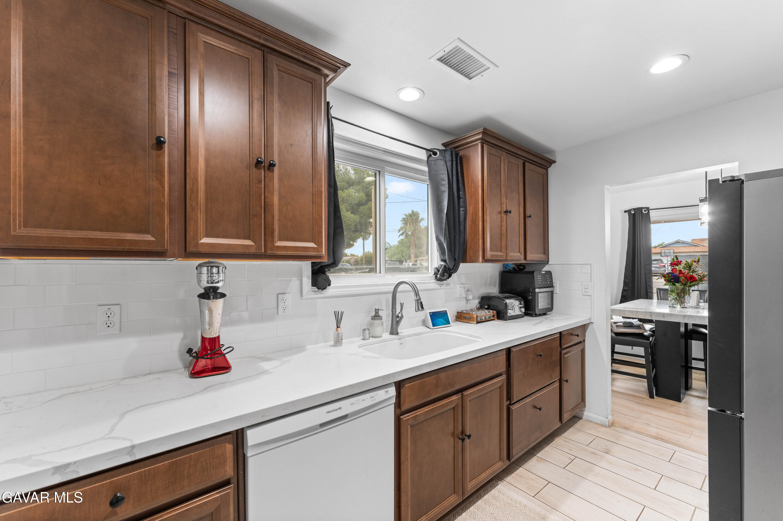 5237 West Ave L8 Lancaster, CA 93536 - Photo 10 of 38 a kitchen with a sink and cabinets