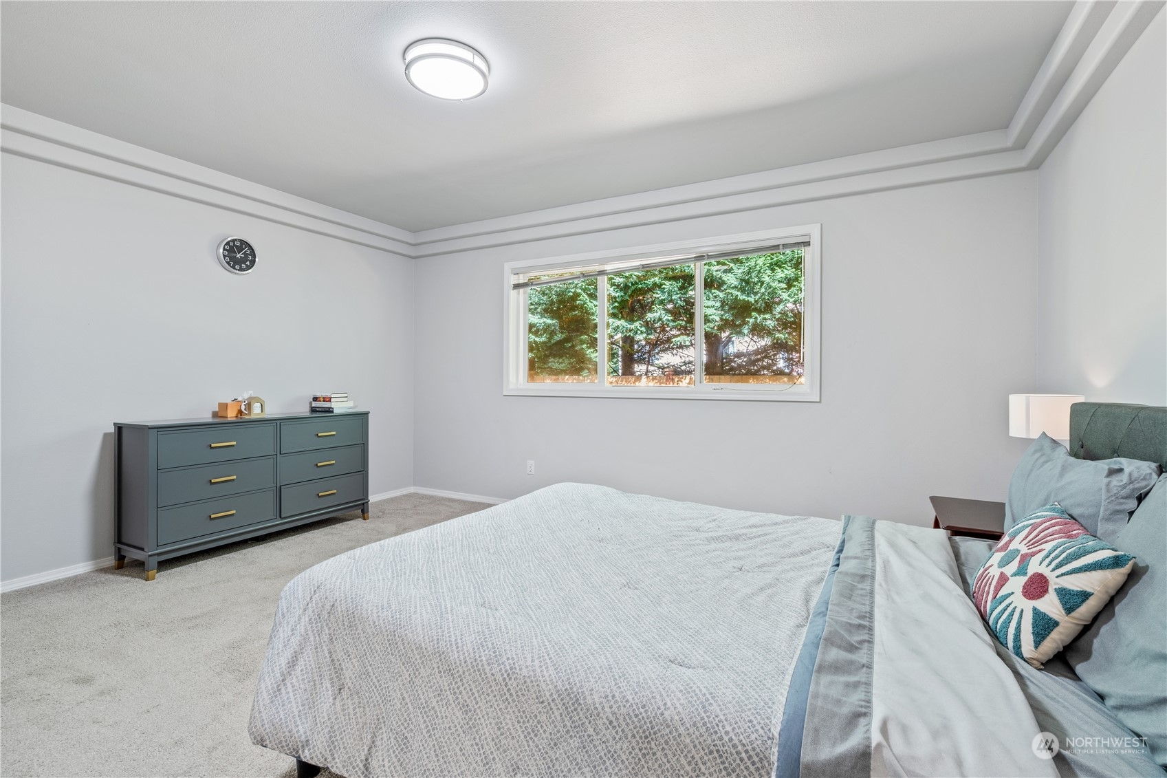 19318 2nd Drive Southeast, Unit B Bothell, WA 98012 - Photo 13 of 28 a bedroom with a bed and window