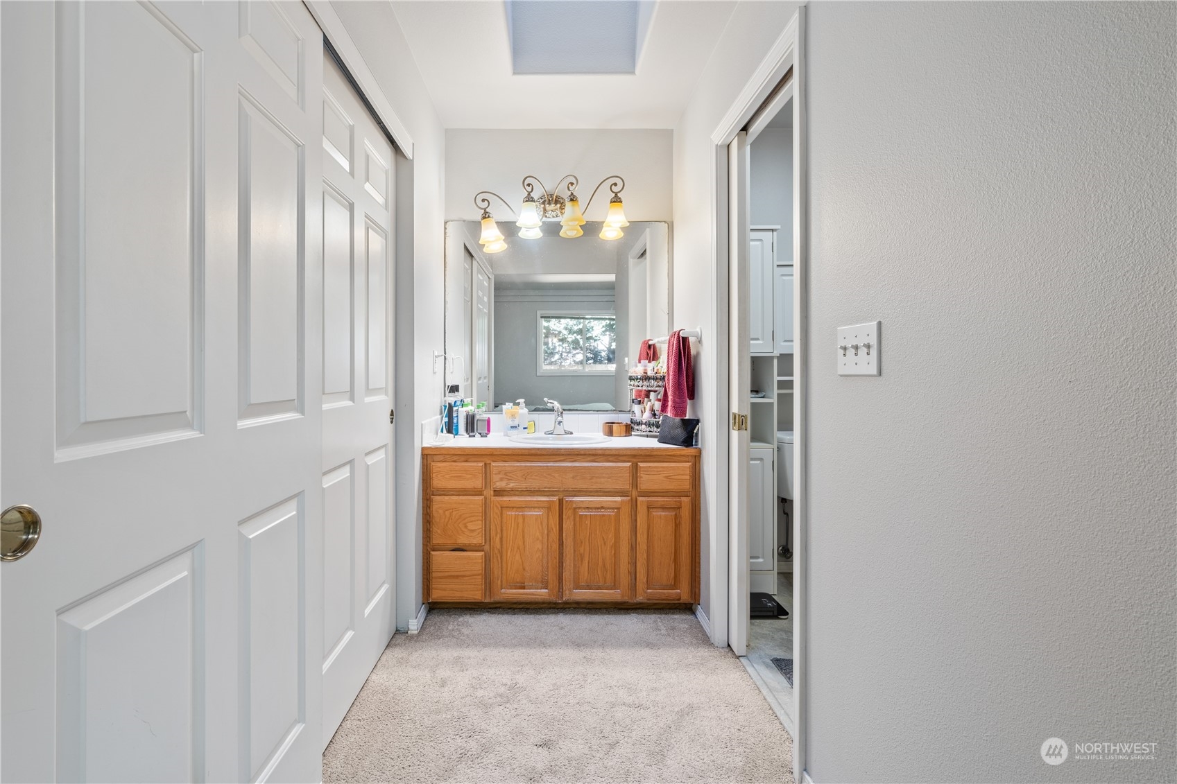 19318 2nd Drive Southeast, Unit B Bothell, WA 98012 - Photo 16 of 28 a bathroom with a granite countertop sink mirror and a bathtub