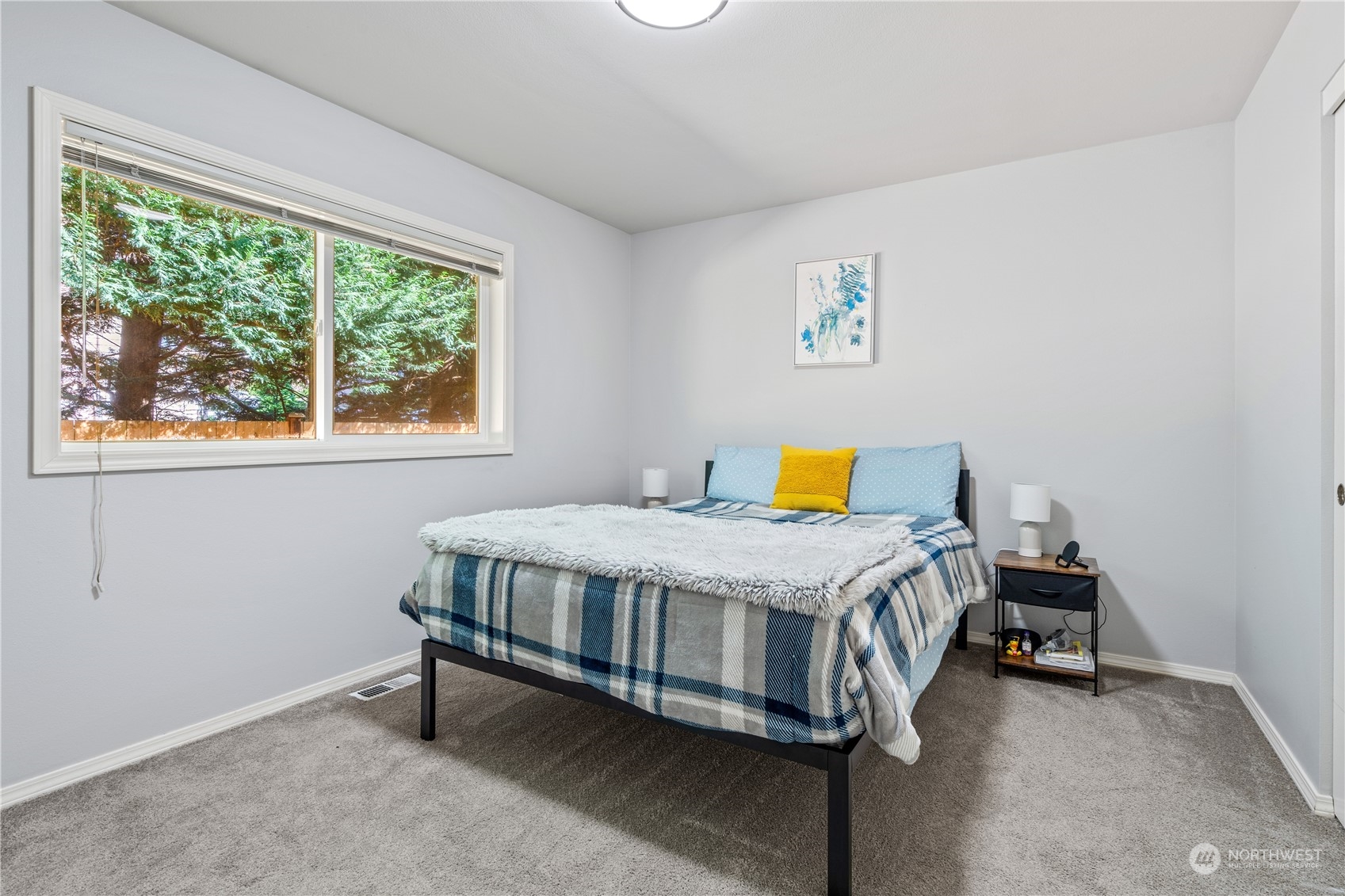 19318 2nd Drive Southeast, Unit B Bothell, WA 98012 - Photo 18 of 28 a bed room with a bed and a window