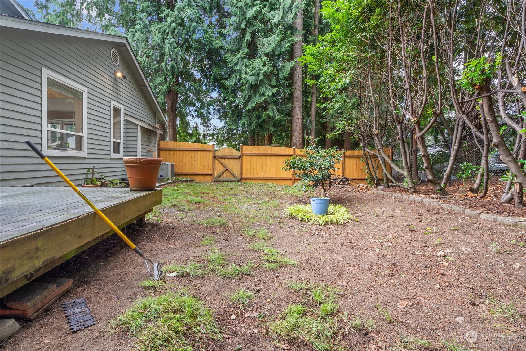 19318 2nd Drive Southeast, Unit B Bothell, WA 98012 - Photo 26 of 28 a backyard of a house with barbeque oven table and chairs