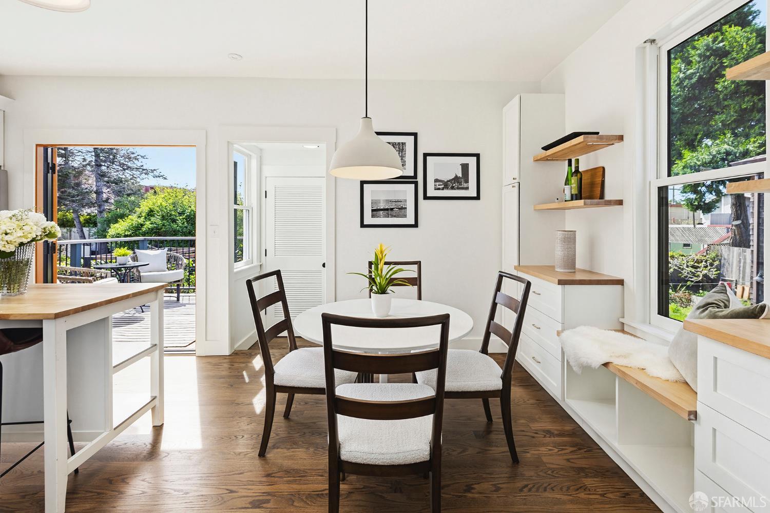1610 Oregon Street Berkeley, CA 94703 - Photo 16 of 68 a view of a dining room with furniture window and wooden floor