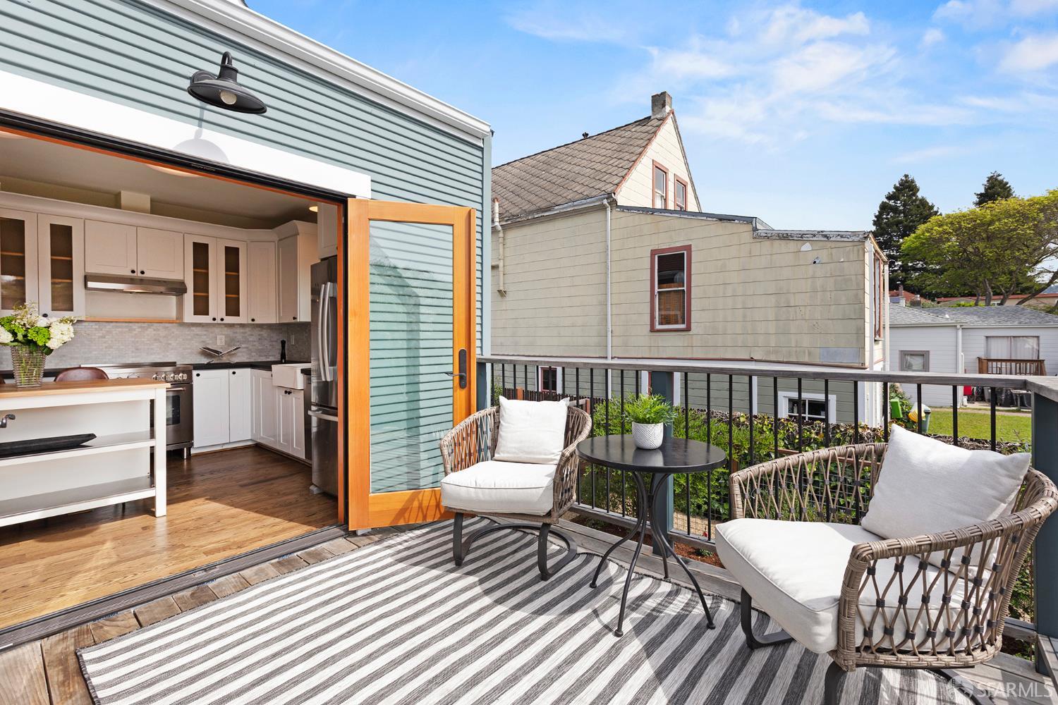 1610 Oregon Street Berkeley, CA 94703 - Photo 26 of 68 a balcony with furniture and a wooden floor