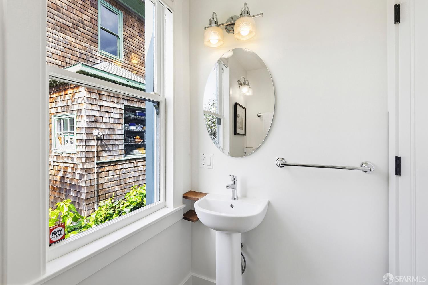 1610 Oregon Street Berkeley, CA 94703 - Photo 28 of 68 a bathroom with a sink and a mirror