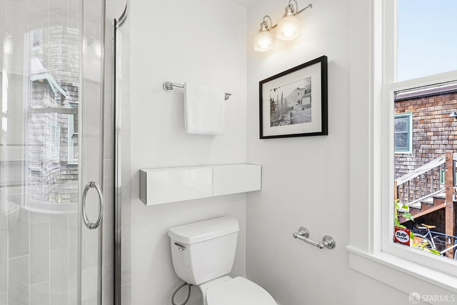 1610 Oregon Street Berkeley, CA 94703 - Photo 29 of 68 a bathroom with a toilet a sink and a shower curtain