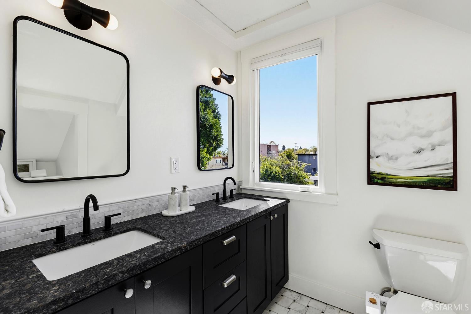 1610 Oregon Street Berkeley, CA 94703 - Photo 30 of 68 a bathroom with a double vanity sink and a mirror