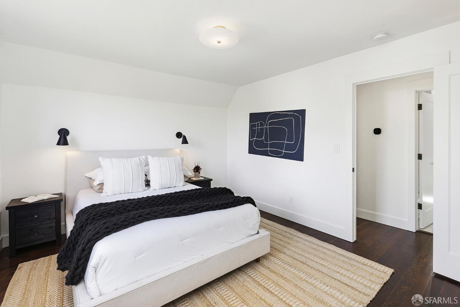 1610 Oregon Street Berkeley, CA 94703 - Photo 34 of 68 a bedroom with a bed and wooden floor