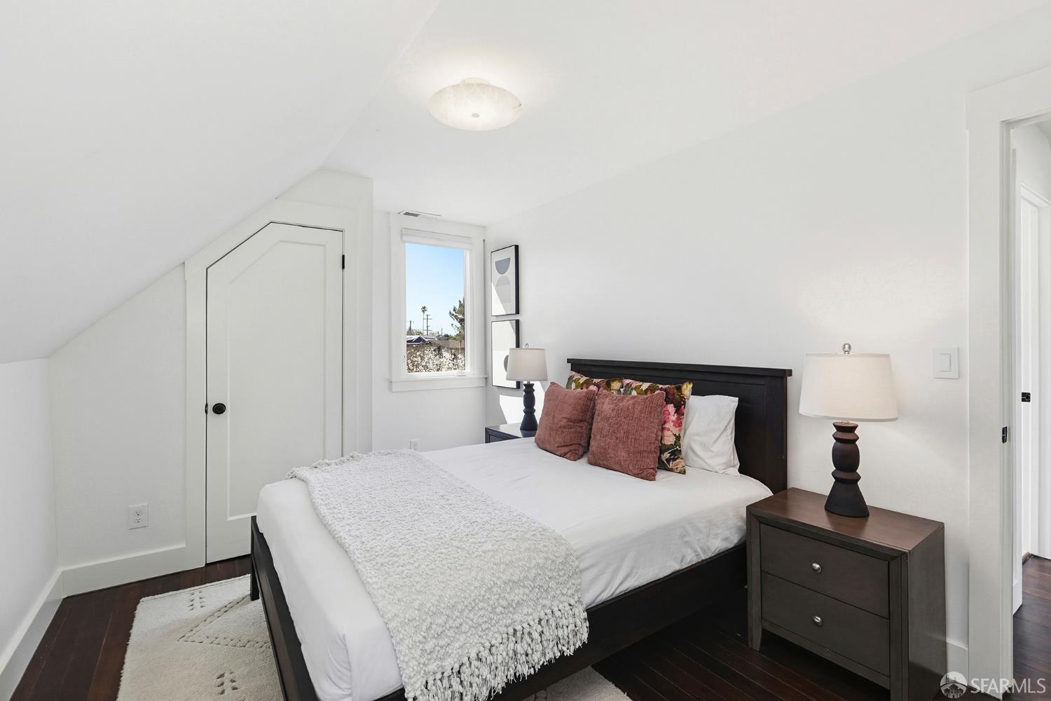 1610 Oregon Street Berkeley, CA 94703 - Photo 35 of 68 a bedroom with a bed and wooden floor